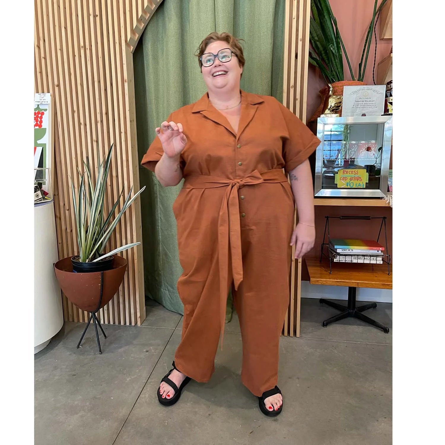 Bumper Jumper sewing pattern — plus size woman wearing a loose-fit orange woven jumper with side pockets, front buttons and roll-up sleeves, front view