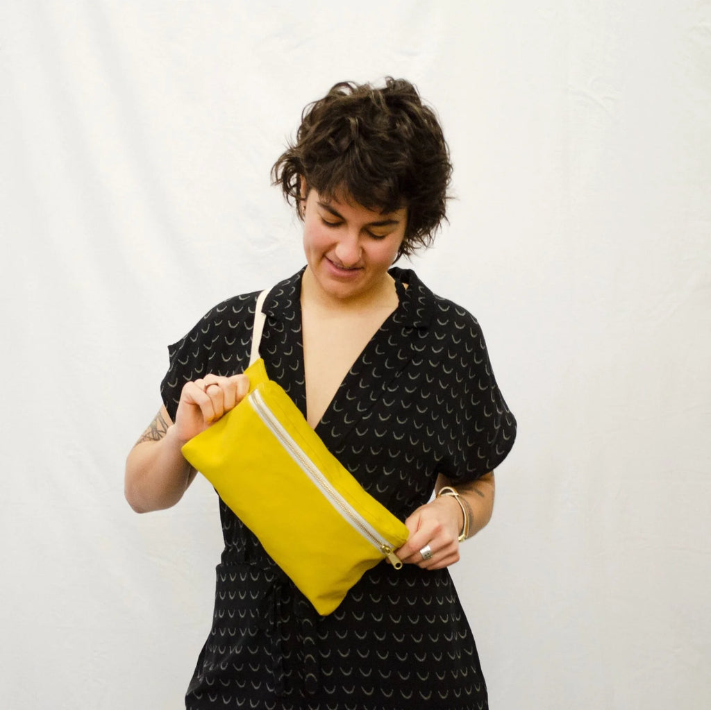 Hip Pack sewing pattern — model wearing yellow over the cross body bag across front of body