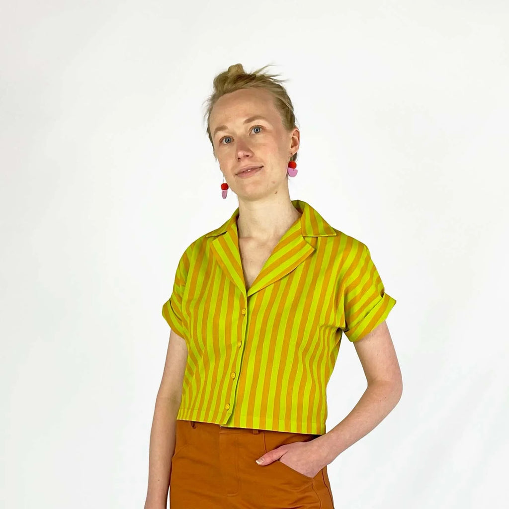 Bumper Bundle sewing pattern — Person wearing a yellow and green striped short sleeved shirt with rolled cuffs against a white background - front view