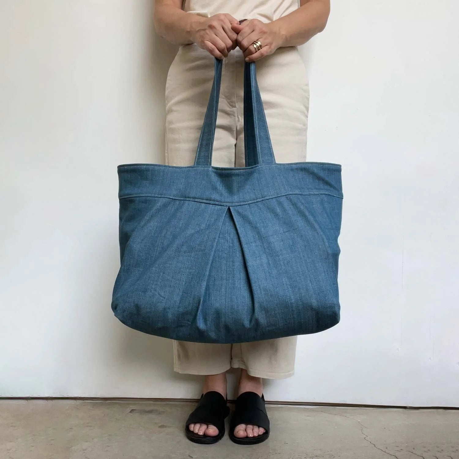 Yard Bag sewing pattern — large handmade denim tote bag with box pleat, front exterior pocket, and double shoulder straps, main view
