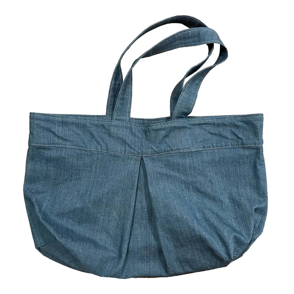 Yard Bag sewing pattern — large handmade denim tote bag with box pleat, front exterior pocket, and double shoulder straps, front view