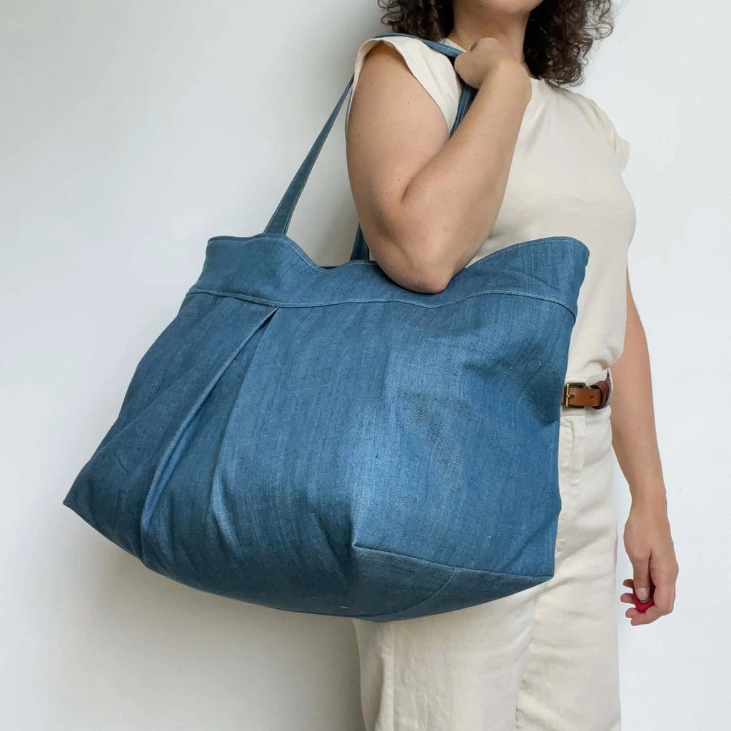 Yard Bag sewing pattern — large handmade denim tote bag with box pleat, front exterior pocket, and double shoulder straps, front shoulder view